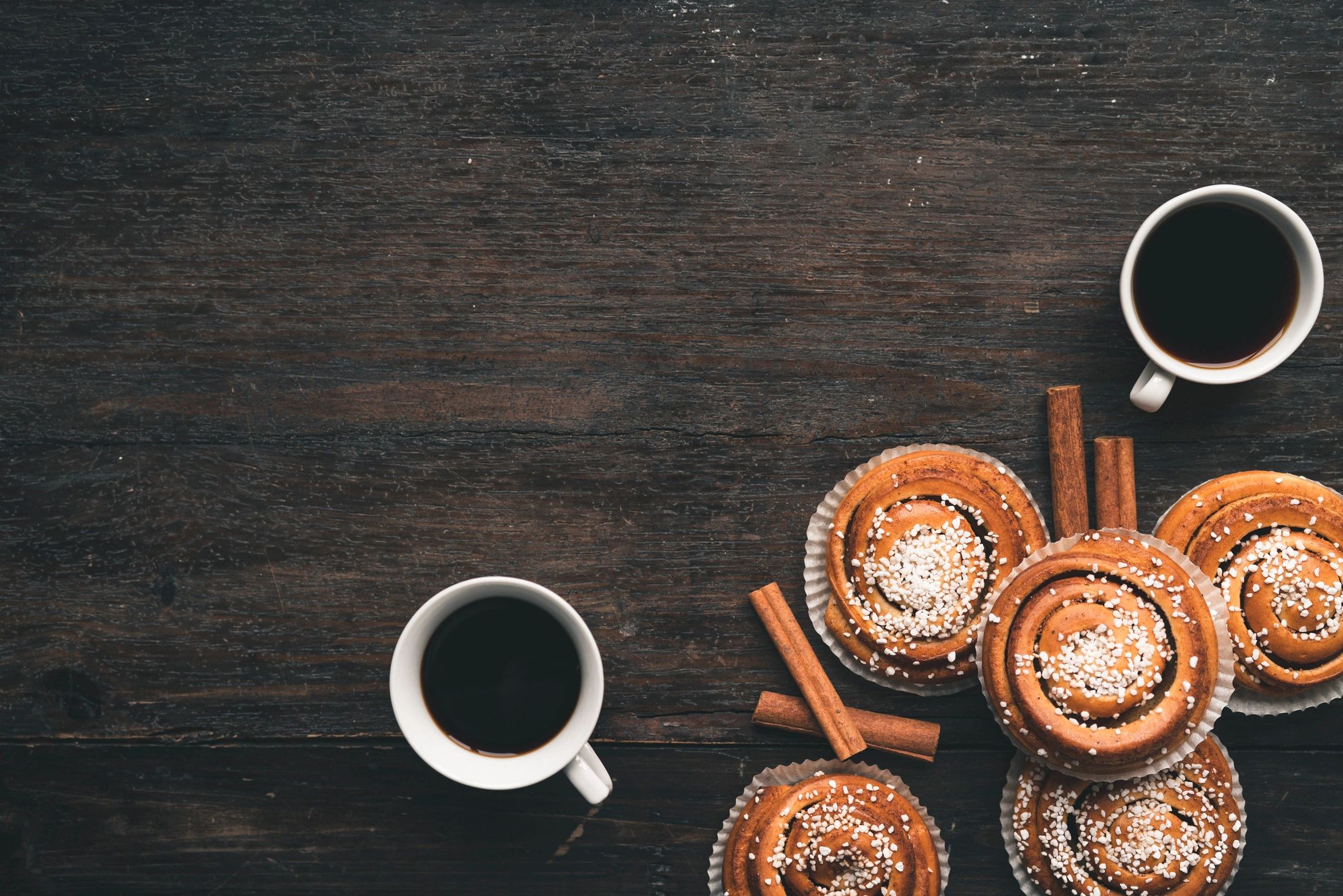 Cinnamon bun on wooden table